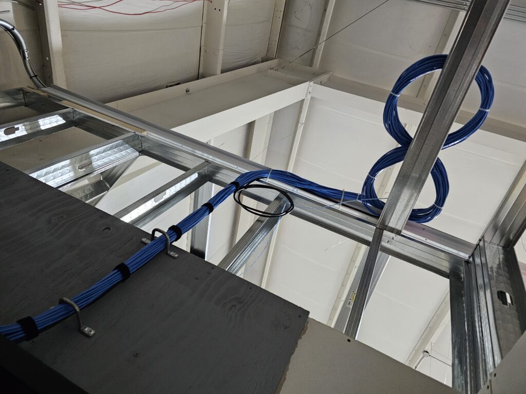 Structured Cat6 cabling neatly installed in ceiling for pharmacy network infrastructure in Brevard County by DSI.
