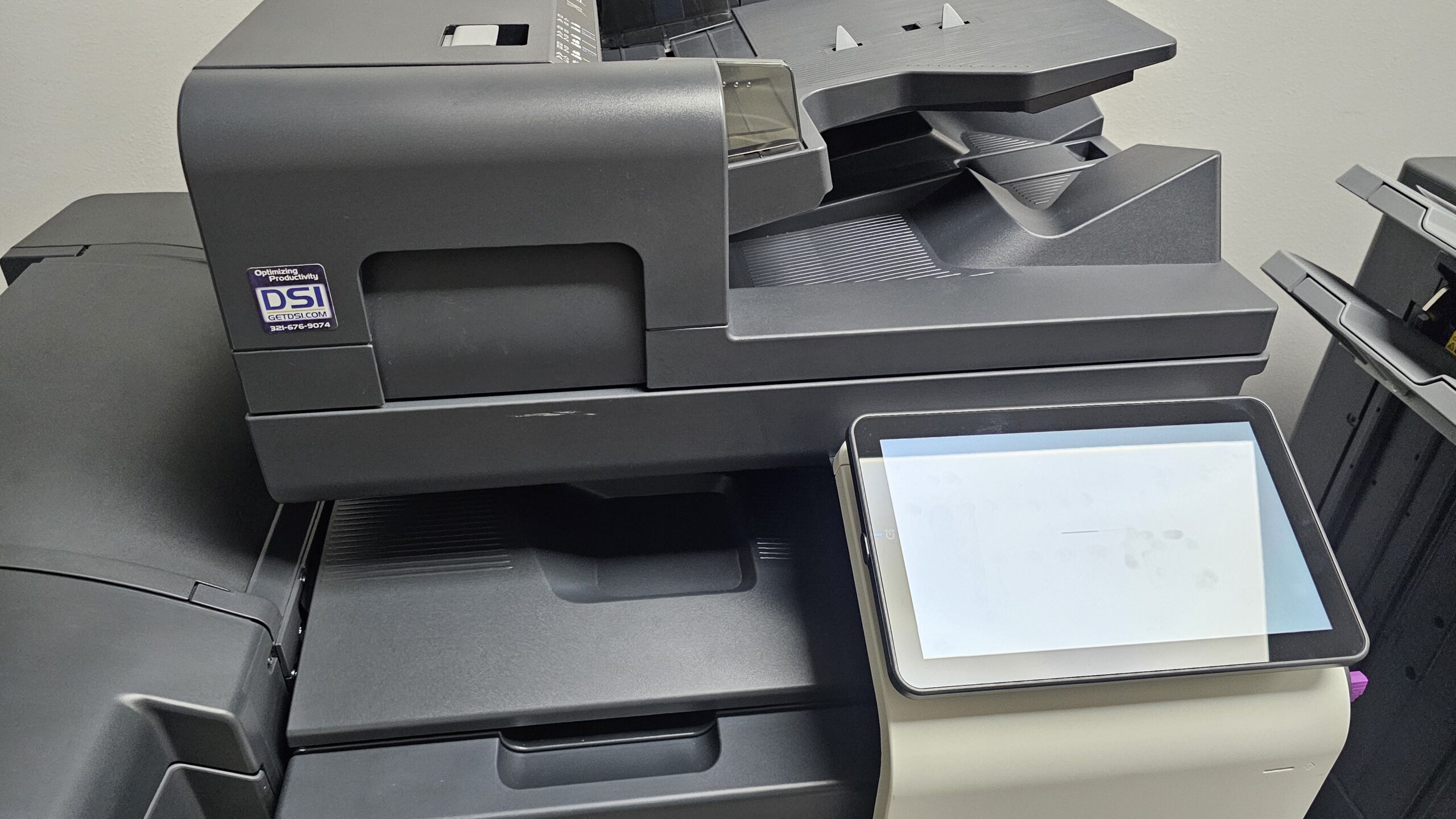 “Konica Minolta copier configured by Digital Systems Integration with RFID card reader for secure printing in government-focused office.”