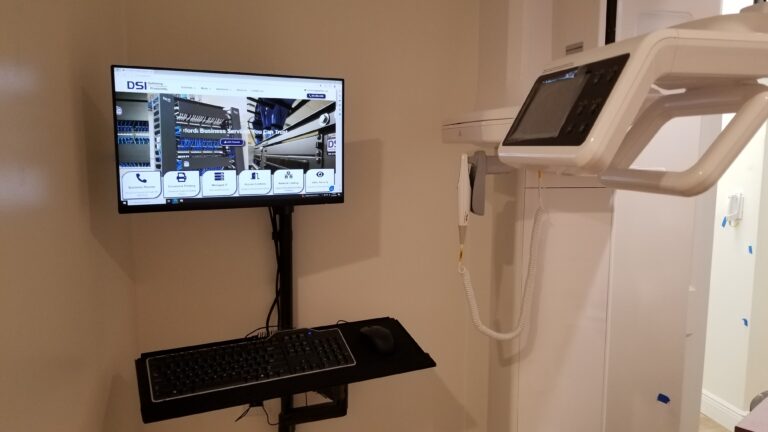 “Dental operatory with networked computer and X-ray monitor maintained by Digital Systems Integration.”